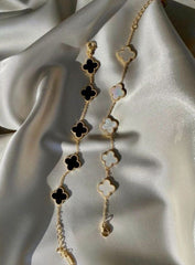 Reversible Clover Charm Bracelet | Gold-Plated Chain with Black & White Enamel Floral Motifs